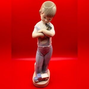 Lladro Mechanic Boy Porcelain Figurine.
